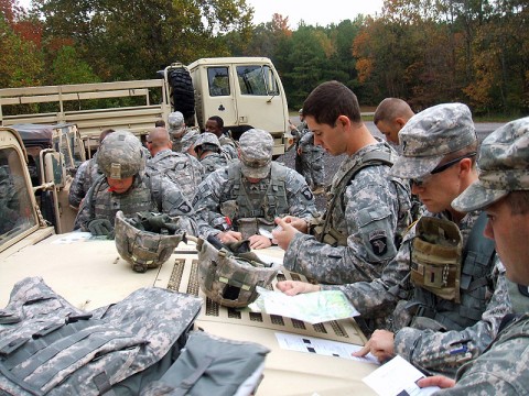 Soldiers from 1st Brigade Combat Team, 101st Airborne Division, mark points on the maps during their Fire Support Team Certification Oct. 13th at the land navigation course. (Photo by Sgt. Jon Heinrich)