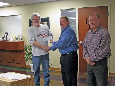 Clarkville Civil War Roundtable presents Clarksville Parks and Recreation with a $800.00 for a picnic table at Fort Defiance Interpretive Center. (L to R) Greg Biggs, Clarksville Civil War Roundtable; Mark Tummons, Clarksville Parks and Recreation Director and William Parker, Fort Defiance Historical Interpreter.