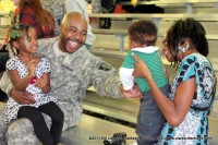 A soldier with the 584th Ordnance Maintenance Company reunited with his family