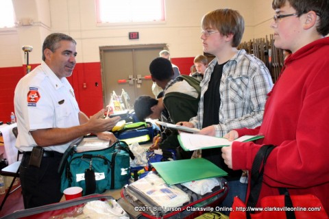 A representative from the Montgomery County EMS speaks with some middle school students