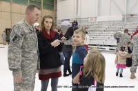 Spc. Edward Getman talks with his kids after arriving home  Wednesday night