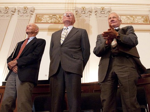 Apollo 11 astronauts, from left, Michael Collins, Neil Armstrong and Buzz Aldrin stand in recognition of astronaut John Glenn during the U.S House of Representatives Committee on Science and Technology tribute to the Apollo 11 astronauts at the Cannon House Office Building on Capitol Hill, Tuesday, July 21st, 2009, in Washington. (Image Credit: NASA/Bill Ingalls)