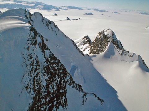 The frozen, inhospitable surface features of Alexander Island in Antarctica were viewed at close range during one of the final low-level flights by NASA's DC-8 flying laboratory during the 2011 Operation IceBridge mission. (NASA /Chris Miller)