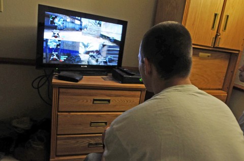 Spc. Sean Russell, a M240 machine gunner with Company B, 2nd Battalion, 327th Infantry Regiment, 1st Brigade Combat Team, 101st Airborne Division, plays a recently released first-person shooter here at the 1st Brigade barracks Nov. 21st. (Photo by Sgt. Richard Daniels Jr.)