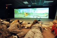 Spouses of the 1st Squadron, 32nd Cavalry, 1st Brigade Combat Team, shoot down enemy turkeys Nov. 19th at the Engagement Skills Trainer here as part of the Spouses’ Spur Ride. (Photo by Sgt. Jon Heinrich)