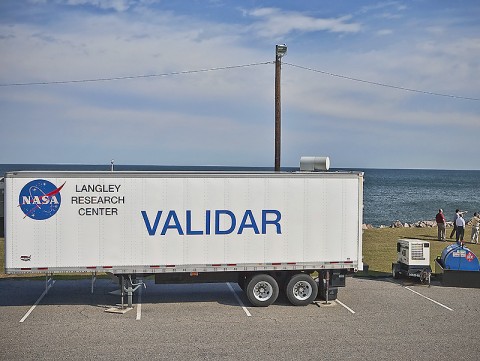 On top of the trailer, upper right, is the part of the WIND instrument that shoots a laser beam to measure winds miles offshore of Virginia Beach, VA. (Credit: Sean Smith/NASA)