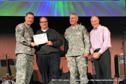 Hank Bonecutter of Bonehead Promotions receives a Commanders Certificate during the 2011 MWR Sponsors Appreciation Dinner