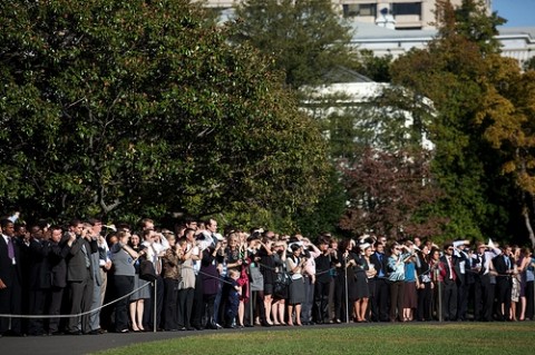 Staff and interns gather on the South Lawn of the White House to watch President Barack Obama's Marine One departure en route to Andrews Air Force Base in Maryland, Oct. 21, 2009. (Official White House Photo by Samantha Appleton) 