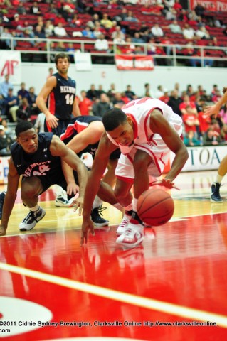 APSU's TyShwan Edmondson (12) tries to get the ball away from Belmont's and Clarksville native Adam Barnes (24) in the Bruins' 77-67 victory over the Govs in the Dunn Center.