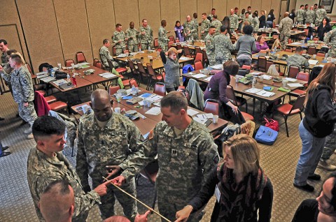 Command teams of the 2nd Brigade Combat Team, 101st Airborne Division (Air Assault) and leaders of the Strike Family Readiness Group perform a team building exercise during a leadership conference at the Family Resource Center, Nov. 30th. About 100 leaders of Strike performed exercises, learned techniques and were provided guidance in creating unit cohesion during the two-day conference.  (U.S. Army photo by Sgt. Joe Padula, 2nd BCT PAO, 101st Abn. Div.)