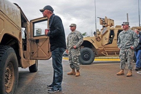 J.R. Martinez, ABC’s ‘Dancing With The Stars’ winner and former 101st Airborne Division (Air Assault) Soldier, looks into an HMMWV, better known as a Humvee, at Fort Campbell, KY, outside of the headquarters of his old unit, Company D, 2nd Battalion, 502nd Infantry Regiment, 2nd Brigade Combat Team, Dec. 4th. The Humvee was the vehicle Martinez was in when he sustained injuries from a land mine blast in Iraq during his 2003 deployment. (U.S. Army photo by Sgt. Joe Padula, 2nd BCT PAO, 101st Abn. Div.)