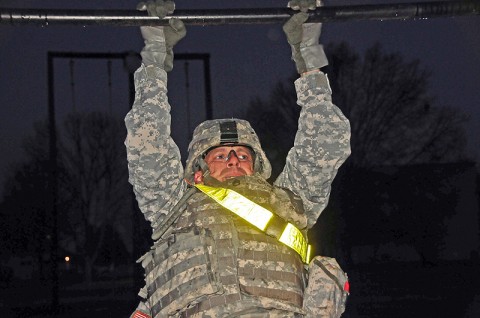 Staff Sgt. Jeffrey Craig, with Company G, 1st Battalion, 320th Field Artillery Regiment, 2nd Brigade Combat Team, 101st Airborne Division (Air Assault), conducts pull-ups in the pre-dawn darkness during the latest ‘Top Guns Blitz’ at Fort Campbell, Ky, Dec. 7th. The platoon leaders of Top Guns participated in the event which focused on physical and mental development. (U.S. Army Photo By Spc. Shawn Denham, PAO, 2nd BCT, 101st Abn. Div.) Staff Sgt. Jeffrey Craig, with Company G, 1st Battalion, 320th Field Artillery Regiment, 2nd Brigade Combat Team, 101st Airborne Division (Air Assault), conducts pull-ups in the pre-dawn darkness during the latest ‘Top Guns Blitz’ at Fort Campbell, Ky, Dec. 7th. The platoon leaders of Top Guns participated in the event which focused on physical and mental development. (U.S. Army Photo By Spc. Shawn Denham, PAO, 2nd BCT, 101st Abn. Div.)