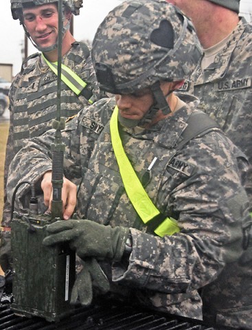 Maj. Neil Snyder,  with Headquarters and Headquarters Battery, 1st Battalion, 320th Field Artillery Regiment, 2nd Brigade Combat Team, 101st Airborne Division (Air Assault), conducts a radio check as part of the ‘Top Guns Blitz’ at Fort Campbell, KY, Dec. 7th. Radios are a key component of field communication and are part of standard warrior tasks and skills training. (U.S. Army Photo By Spc. Shawn Denham, PAO, 2nd BCT, 101st Abn. Div.)