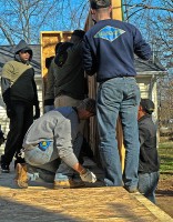 Soldiers with 2nd Battalion, 502nd Infantry Regiment, 2nd Brigade Combat Team, 101st Airborne Division (Air Assault), and workers from Habitat for Humanity hold a wall section up for installation in Hopkinsville, KY, Dec. 10th. The Strike Force Soldiers aided the construction efforts to build a foundation, floor braces and wall sections. (U.S. Army Photo By Spc. Shawn Denham, PAO, 2nd BCT, 101st Abn. Div.)