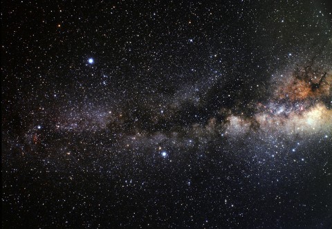 Thick dust clouds block our night-time view of the Milky Way, creating what is sometimes called the Dark Rift. The fact that -- from the viewpoint of Earth -- the sun aligns with these clouds, or the galactic center, near the winter solstice is no cause for concern. (Credit: A. Fujii)