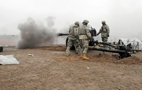 Section 1, Battery A, 2nd Battalion, 320th Field Artillery, 1st Brigade Combat Team, 101st Airborne Division, conduct direct fire missions with a M119 Howitzer Dec. 6th in Fort Knox, KY. The battalion trained here in order to complete their artillery tables. (Photo by Sgt. Jon Heinrich)