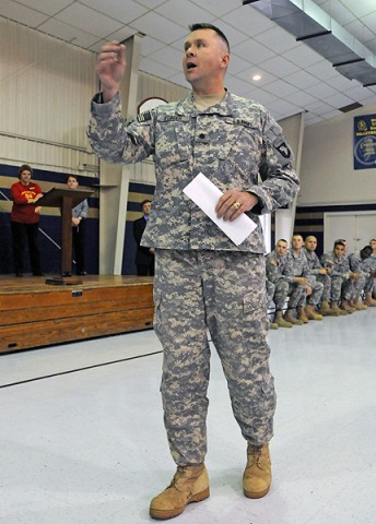 Lt. Col. Matthew Stader, commander of 2nd Battalion, 320th Field Artillery, 1st Brigade Combat Team, speaks to the students at Saint Edwards School, Nov. 29th inside the school’s gymnasium. (Photo by Sgt. Jon Heinrich)