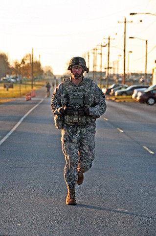 Capt. Patrick Glass, commander, Company C, 526th Brigade Support Battalion, 2nd Brigade Combat Team, 101st Airborne Division (Air Assault), runs on Fort Campbell’s Tennessee Ave. in full combat gear for a total of one-mile and a half while taking the Iron Strike Combat Physical Fitness Test, Nov. 10th. The ISCPFT is designed to better prepare Strike Soldiers for future combat operations. (U.S. Army photo by Sgt. Joe Padula, 2nd BCT PAO, 101st Abn. Div.)