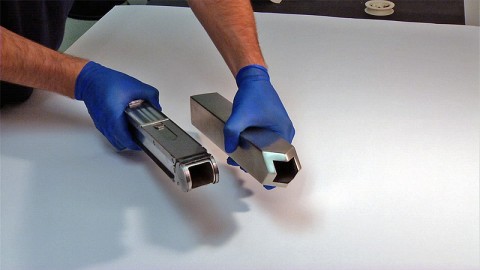 This is a photo of a prototype harpoon tip (right) and sample collection chamber (left). (Credit: NASA/Rob Andreoli)