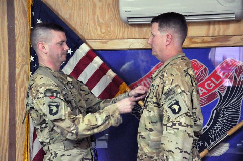 Col. Todd Royar (left), the commander of the 159th Combat Aviation Brigade, promotes Tyler, Texas, native Kyle Hill to chief warrant officer five during a ceremony at Forward Operating Base Wolverine, Afghanistan, Dec. 1st. (Courtesy Photo)