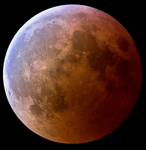 This photo, taken by Jens Hackman of Weikersheim, Germany, during a total lunar eclipse in March 2007, shows the turquoise outskirts and red core of Earth's shadow sweeping across the face of the Moon.