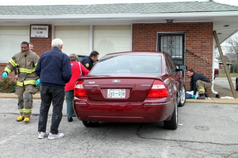 Emergency workers removing the 72 year old man from being pinned. (Photo by CPD Jim Knoll)