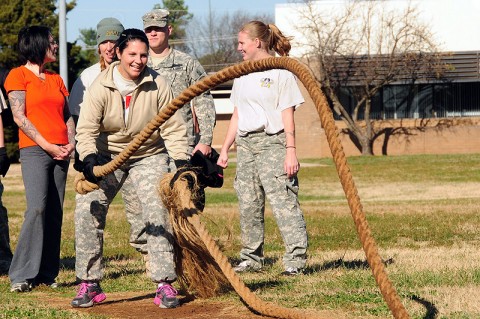 Amanda Henry, wife of Capt. Devin Henry with 1st Squadron, 75th Cavalry Regiment, 2nd Brigade Combat Team, 101st Airborne Division (Air Assault), tosses ropes in an obstacle course challenge during the ‘Spouse Spur Ride’ at Fort Campbell, KY, Nov. 18th. Strike CAV hosted the event to bring Soldiers and families together, building camaraderie. (U.S. Army Photo By Spc. Shawn Denham, PAO, 2nd BCT, 101st Abn. Div.)