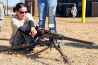 Molli Igou, wife of Spc. Eduardo Mendez with 1st Squadron 75th Cavalry Regiment, 2nd Brigade Combat Team, 101st Airborne Division (Air Assault), charges a Browning M2 .50 caliber machine gun during the ‘Spouse Spur Ride’ at Fort Campbell, KY, Nov. 18th. Weapons familiarization was one of several events meant to demonstrate to the spouses what their husbands do on a daily basis. (U.S. Army Photo By Spc. Shawn Denham, PAO, 2nd BCT, 101st Abn. Div.)