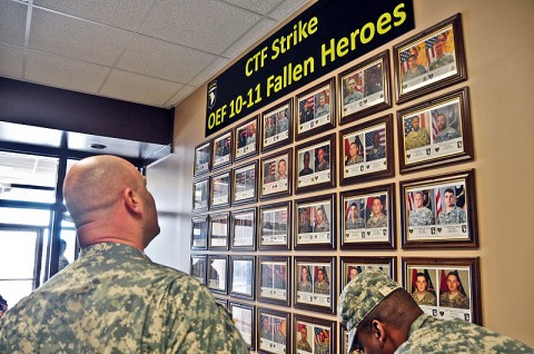 Spc. Michael Waskom, previously with Company A, 2nd Battalion, 502nd Infantry Regiment, 2nd Brigade Combat Team, 101st Airborne Division (Air Assault), looks at the Combined Task Force Strike Operation Enduring Freedom 10-11 Fallen Heroes Wall outside of the Strike Store during a visit to the 2nd BCT, Jan. 12th. Waskom was wounded Sept. 5th, 2010 from an Improvised Explosive Device and is currently with Fort Campbell’s Warrior Transition Battalion, (U.S. Army photo by Sgt. Joe Padula, 2nd BCT PAO, 101st Abn. Div.)