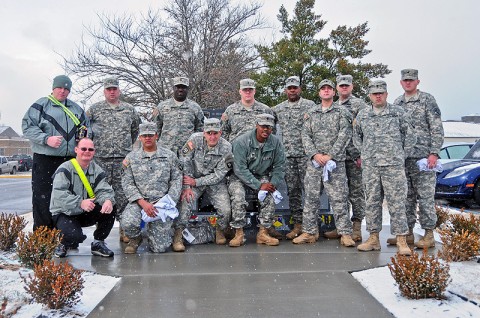 Command Sgt. Maj. Alonzo Smith, command sergeant major, 2nd Brigade Combat Team, 101 Airborne Division (Air Assault) and 12-Strike Wounded Warriors, stand in front of the Combined Task Force Strike Fallen Hero Monument during a visit back to Strike, Jan. 12th. The wounded warriors are currently assigned to Fort Campbell’s Warrior Transition Battalion and still carry a strong bond with the 2nd BCT. (U.S. Army photo by Sgt. Joe Padula, 2nd BCT PAO, 101st Abn. Div.)