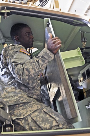 Spc. O'Neil Davis, a light-wheeled mechanic with Company B, 426th Brigade Support Battalion, 1st Brigade Combat Team, 101st Airborne Division, removes parts of the M1200 Armored Knight during a hands-on portion of a class here Jan. 10th at the brigade motor pool. (Photo by Sgt. Richard Daniels Jr.)