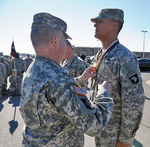 U.S. Army Col. Michael P. Peterman, the commander of the 101st Sustainment Brigade, 101st Airborne Division, presents the Honorable Order of Saint Martin Medal to Staff Sgt. Jonathan R. Welch, the Combat Service Support Automations Management Office non-commissioned officer-in-charge with Headquarters and Headquarters Company, 801st Brigade Support Battalion, 4th Brigade Combat Team, 101st Airborne Division and native of Henderson, Tenn., during a ceremony, Jan. 6, 2012 at Fort Campbell, Ky.