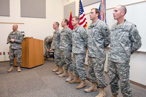 Lt. Col Mike Hertzendorf (left), 1st Battalion, 160th SOAR (A) commander, addresses the crowd as he prepares to present the Distinguished Flying Cross to eight Soldiers during an awards ceremony at Fort Campbell, KY. January 6th, 2012. (160th Special Operations Aviation Regiment photo)