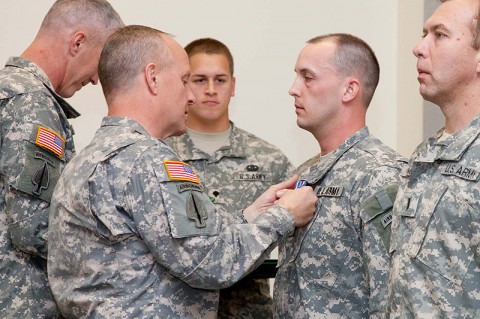 Brig. Gen. Kevin Mangum (left), commander of the U.S. Army Special Operations Aviation Command, pins the Distinguished Flying Cross on Capt. Michael Hilquest.  Hilquest, a MH-6M Little Bird pilot, earned the Distinguished Flying Cross for his heroism during a mission in support of Operation Enduring Freedom.  (160th Special Operations Aviation Regiment photo)