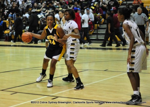 Northeast's Desiree Wilks and Kenwood's Blake Jenkies guard each other in Kenwood's 61-40 District 10-AAA victory on January 27th, 2012.