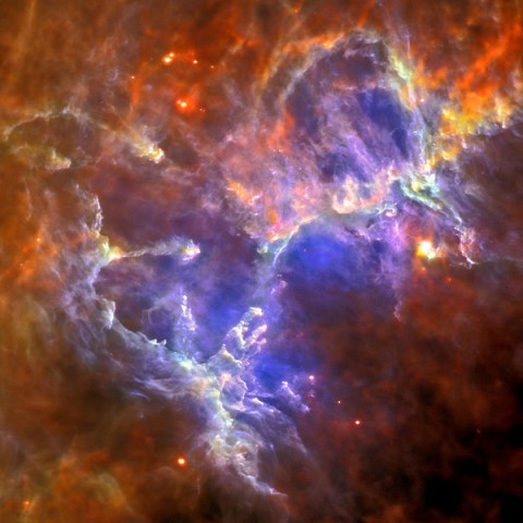 The Herschel Space Observatory captured this image of the Eagle nebula, with its intensely cold gas and dust. The "Pillars of Creation," made famous by NASA'S Hubble Space Telescope in 1995, are seen inside the circle. (Image credit: ESA/Herschel/PACS/SPIRE/Hill, Motte, HOBYS Key Programme Consortium)