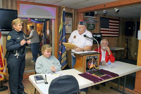 Post Commander Larry Helser reading the award citation to Officer Caver. (Photo by CPD-Jim Knoll)