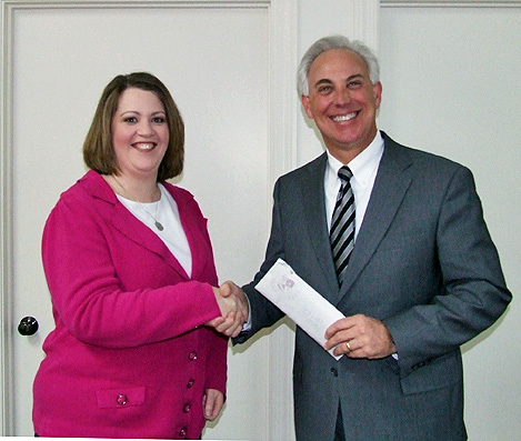 Angela McChesney (L) representing Daymar Institute, presents the proceeds from their Holiday Craft Fair to Chairman of the Board of Crisis 211, Pat Sawyer. The event, held at Daymar on December 10th, brought in over $800.00 for the on-going mission of Crisis 211. Angela McChesney (L) representing Daymar Institute, presents the proceeds from their Holiday Craft Fair to Chairman of the Board of Crisis 211, Pat Sawyer. The event, held at Daymar on December 10th, brought in over $800.00 for the on-going mission of Crisis 211.
