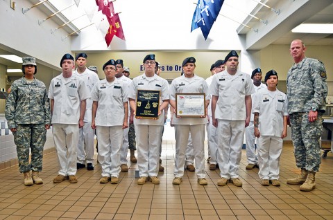 Command Sgt. Maj. Mark Herndon, Fort Campbell’s garrison command sergeant major, poses for a picture with the winners of the Commander’s Certificate, the Strike Dining Facility staff from the 2nd Brigade Combat Team, 101st Airborne Division (Air Assault) during the award ceremony held at the Strike Dining Facility, Jan. 24th. The Commander’s Certificate is awarded for best dining facility during the Thanksgiving holiday. (U.S. Army photo by Sgt. Joe Padula, 2nd BCT PAO, 101st Abn. Div.)