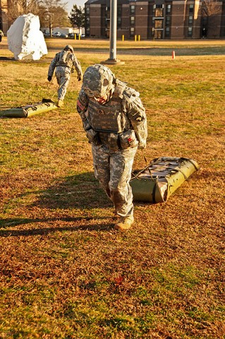 Sgt. 1st Class Abby Blaisdell, the civil affairs specialist with Headquarters and Headquarters Company, 2nd Brigade Combat Team, 101st Airborne Division (Air Assault), drags a weighted medical liter 100-meters during a combat focused physical training event. (U.S. Army photo by Sgt. Joe Padula, 2nd BCT PAO, 101st Abn. Div.)