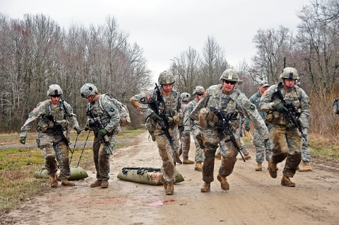 Soldiers from a deploying Security Force Assistance Team with the 2nd Battalion, 502nd Infantry Regiment, 2nd Brigade Combat Team, 101st Airborne Division (Air Assault), drag a weighted medical litter during a stress shoot training exercise at Fort Campbell’s Range 40a, Feb. 16th. The stress shoot training exercises put the Strike Force Soldiers though highly intense situations. (U.S. Army photo by Sgt. Joe Padula, 2nd BCT PAO, 101st Abn. Div.)