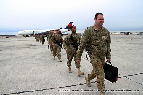 Soldier's walk to the hanger after disembarking from the aircraft