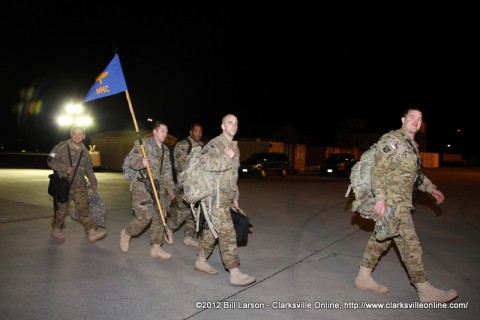 Soldiers pass by their excited families as they head for the hangar