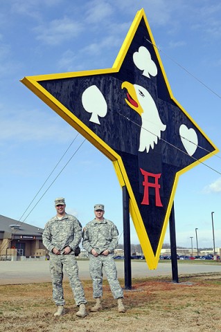 Sgt. James Croghan (left) and Sgt. David Eldridge of the 101st Sustainment Brigade, stand proudly in front of the Brigade’s “Deathstar” Symbol. The two led a five-man team in working round the clock to construct the the symbol of pride and excellence. (Photo by Spc. Michael Vanpool)