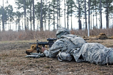 Pfc. Mckindrea Harvey, a cook with 1st Squadron, 32nd Cavalry Regiment, 1st Brigade Combat Team, 101st Airborne Division, shoots her M4 rifle during a squad live fire exercise, here, Feb. 15th. The live fire was both a training opportunity for the soldiers and a test for leadership within the unit. (Photo by Sgt. Richard Daniels Jr.) Pfc. Mckindrea Harvey, a cook with 1st Squadron, 32nd Cavalry Regiment, 1st Brigade Combat Team, 101st Airborne Division, shoots her M4 rifle during a squad live fire exercise, here, Feb. 15th. The live fire was both a training opportunity for the soldiers and a test for leadership within the unit. (Photo by Sgt. Richard Daniels Jr.)
