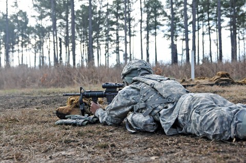 Pfc. Mckindrea Harvey, a cook with 1st Squadron, 32nd Cavalry Regiment, 1st Brigade Combat Team, 101st Airborne Division, shoots her M4 rifle during a squad live fire exercise, here, Feb. 15th. The live fire was both a training opportunity for the soldiers and a test for leadership within the unit. (Photo by Sgt. Richard Daniels Jr.)