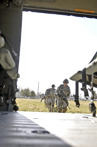 Soldiers of the 3rd Platoon, Company A, 1st Squadron, 32nd Cavalry Regiment, 1st Brigade Combat Team, 101st Airborne Division, head to the helicopter to load up for their air assault, here, at Johnson Field, Feb. 22nd. This is their first air assault as a platoon since they returned from Afghanistan in 2011. (Photo by Sgt. Richard Daniels Jr.)