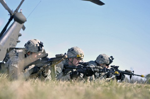 Soldiers of the 3rd Platoon, Company A, 1st Squadron, 32nd Cavalry Regiment, 1st Brigade Combat Team, 101st Airborne Division, pull security after unloading a helicopter, here, at Johnson Field, Feb. 22nd. This is their first air assault as a platoon since they returned from Afghanistan in 2011. (Photo by Sgt. Richard Daniels Jr.)