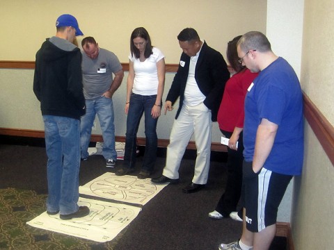 Families of the 101st Sustainment Brigade learn how to do the awareness wheel, an exercise at the brigade’s Strong Bonds retreat. The three-day workshop allowed families to strengthen relationships, inspire hope and rekindle marriages, away from post. (Courtesy Photo)