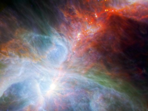  This new view of the Orion nebula highlights fledgling stars hidden in the gas and clouds. (Image credit: NASA/ESA/JPL-Caltech/IRAM)